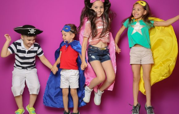 Playful little children in cute costumes indoors Playful little children in cute costumes indoors